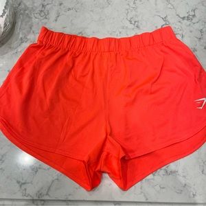 Gymshark neon orange/pink running shorts
